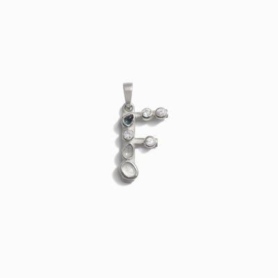 Awe Inspired's Gemstone Initial Pendant is a silver pendant in the shape of the letter "F," adorned with small, clear bezel-set gemstones. Perfect for those who love personalized jewelry and initial charms.