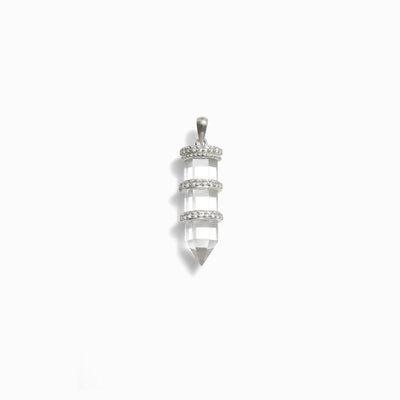 Awe Inspired's Manifestation Crystal Amulet boasts a clear, faceted quartz crystal encased in three elegant silver bands adorned with small, round stones and suspended from a delicate silver bail.