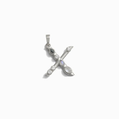 Awe Inspired's Gemstone Initial Pendant features a silver 'X' adorned with bezel set gemstones.