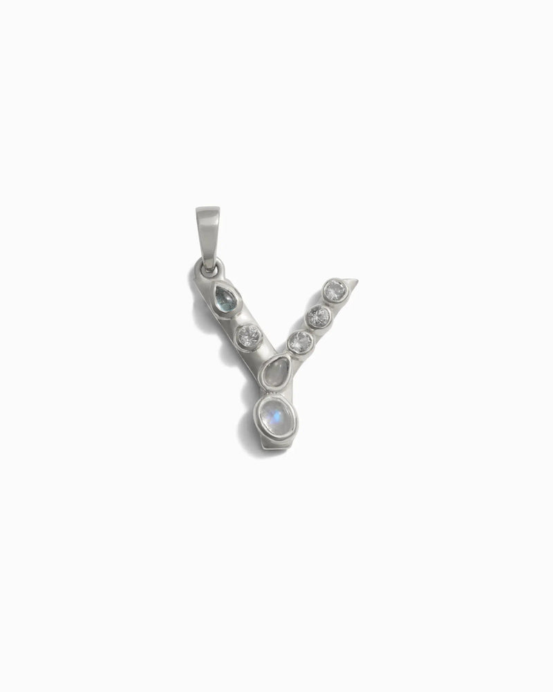 Awe Inspired's Gemstone Initial Pendant features a silver "Y" adorned with multiple bezel-set gemstones along its structure.