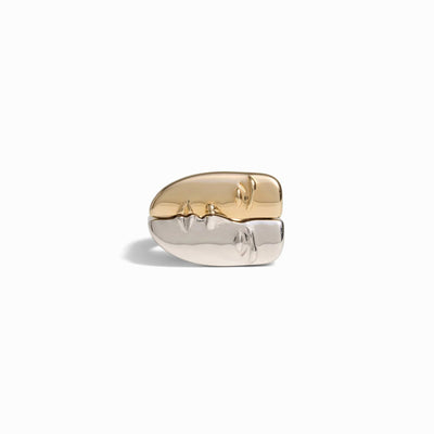 The "Face to Face Rings" by Awe Inspired, featuring an abstract gold and silver design perfect for a statement ring stack, is showcased against a plain white background.